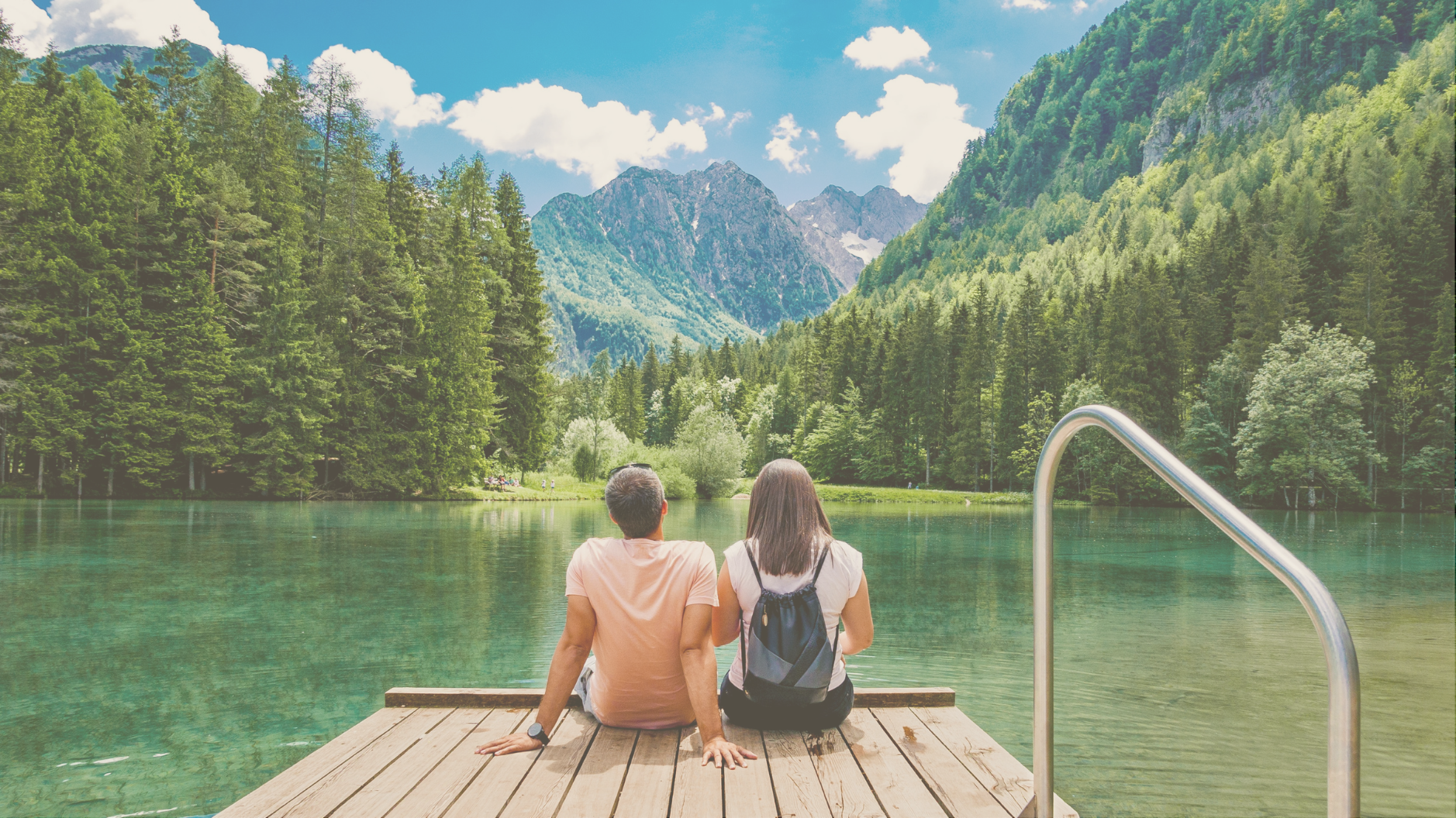 A young couple enjoying a serene luxury RV camping trip, combining outdoor adventure with high-end comfort.